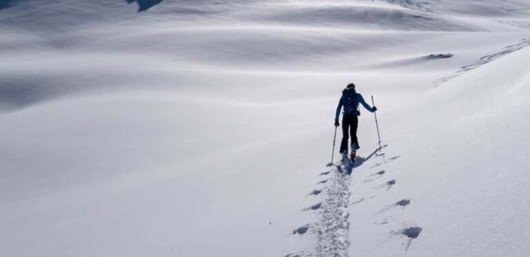 lonely tracks in the ascent on a ski tour