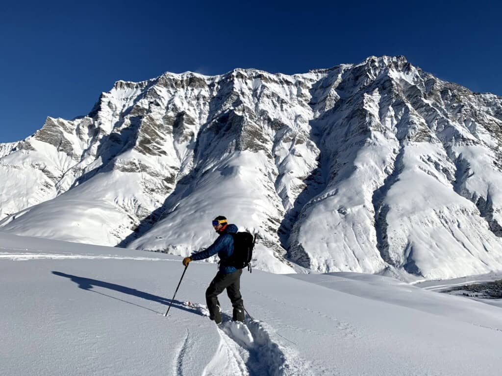 Florian skiing downhill in powder