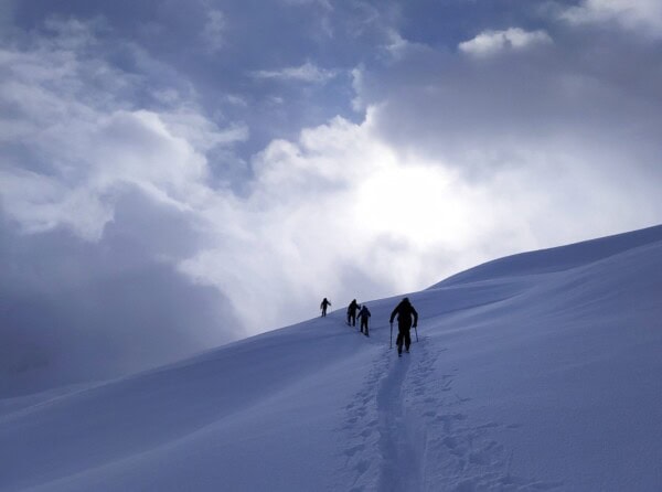 in the foggy ascent on skis