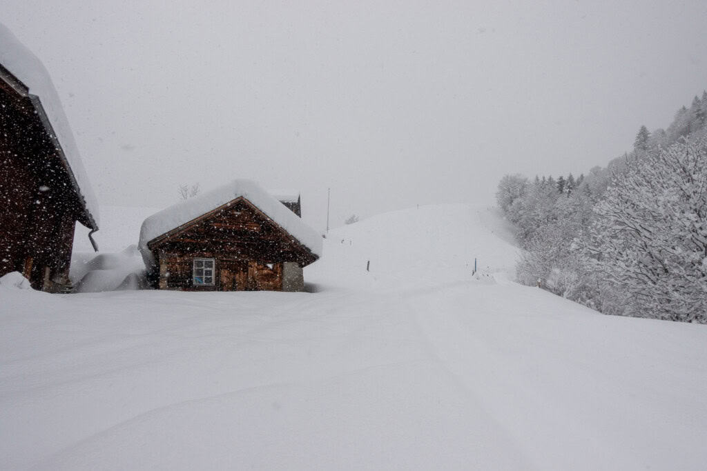 Snow-covered alpine hut in Glarnerland